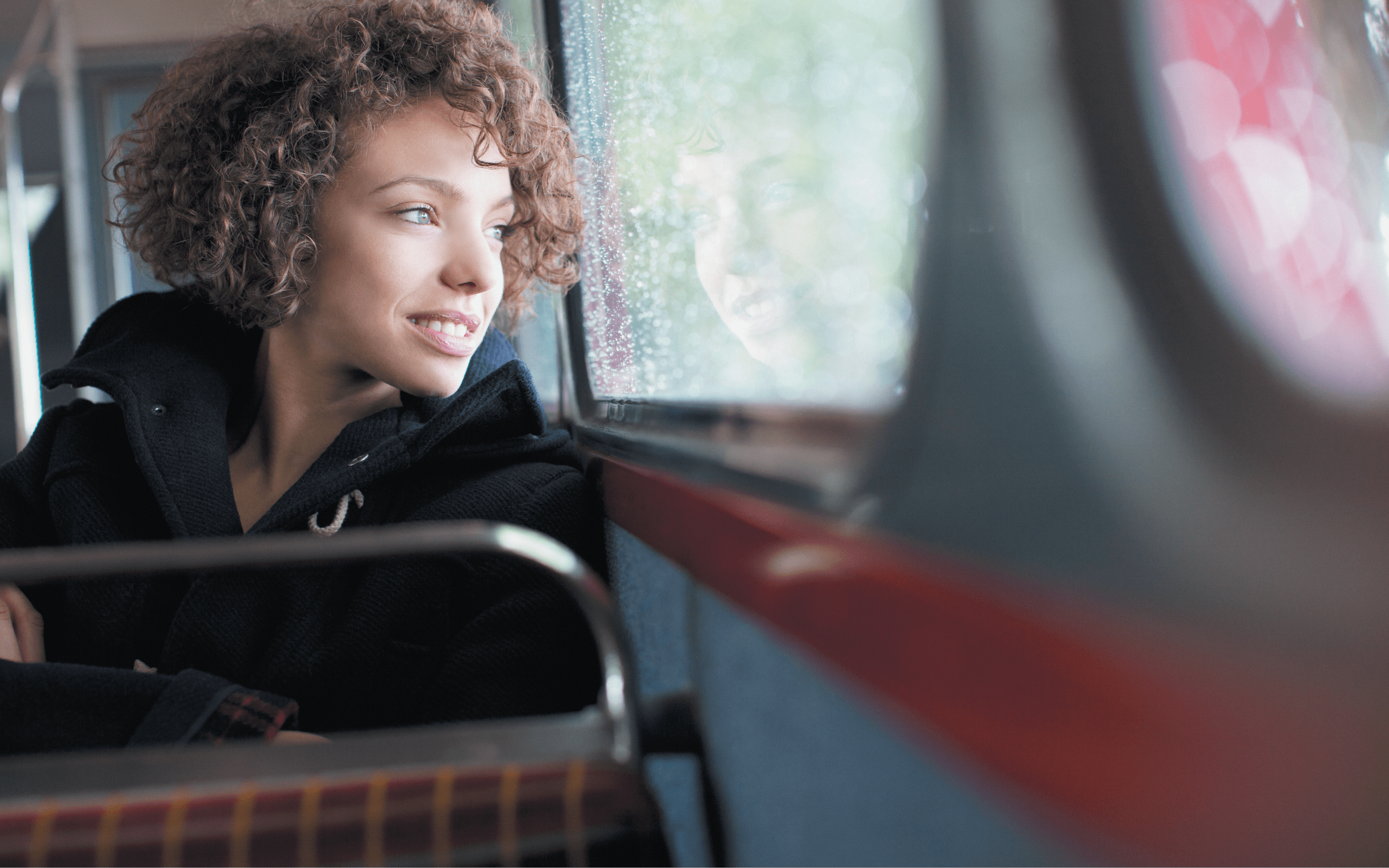 Smiling woman riding bus 137086498