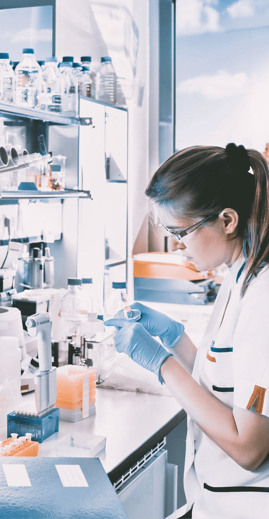 Young scientist works in modern biological lab, toned image workspace,lab,research,professional,experiment,white,concentrate