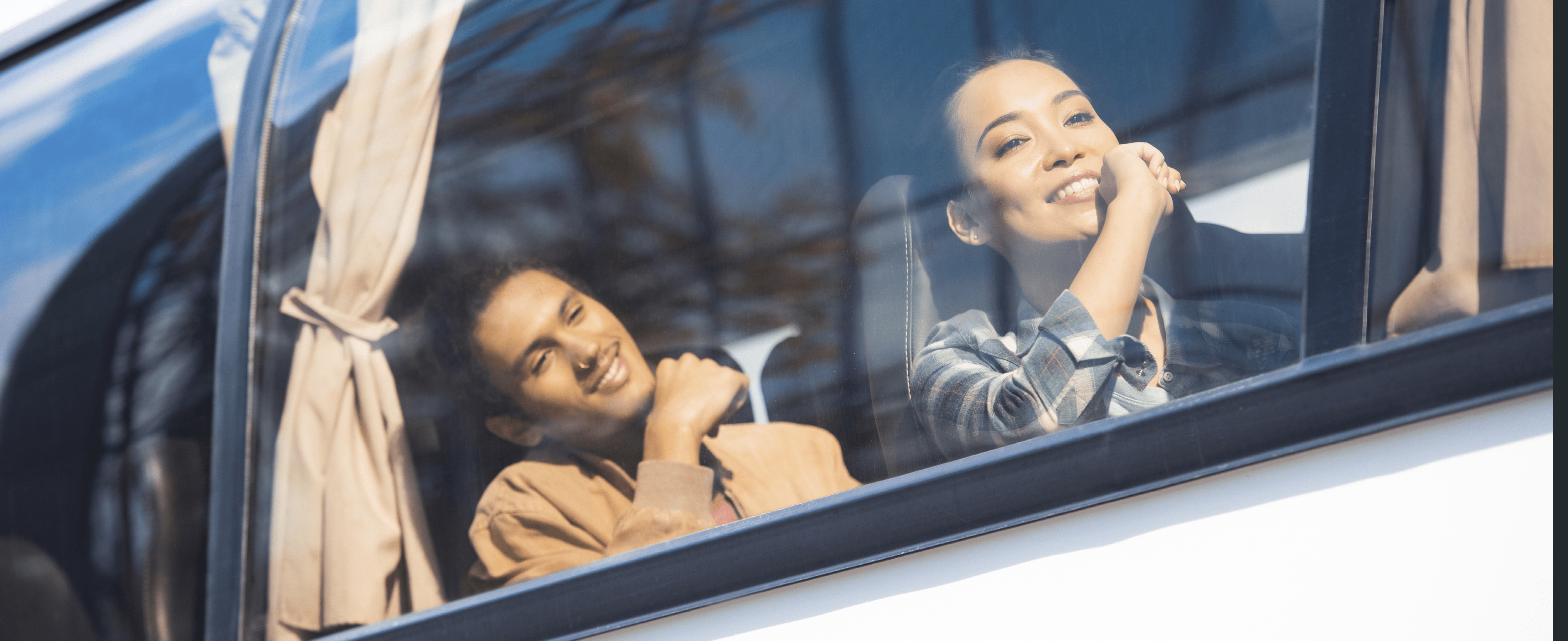 happy asian and mixed race tourists during trip on travel bus