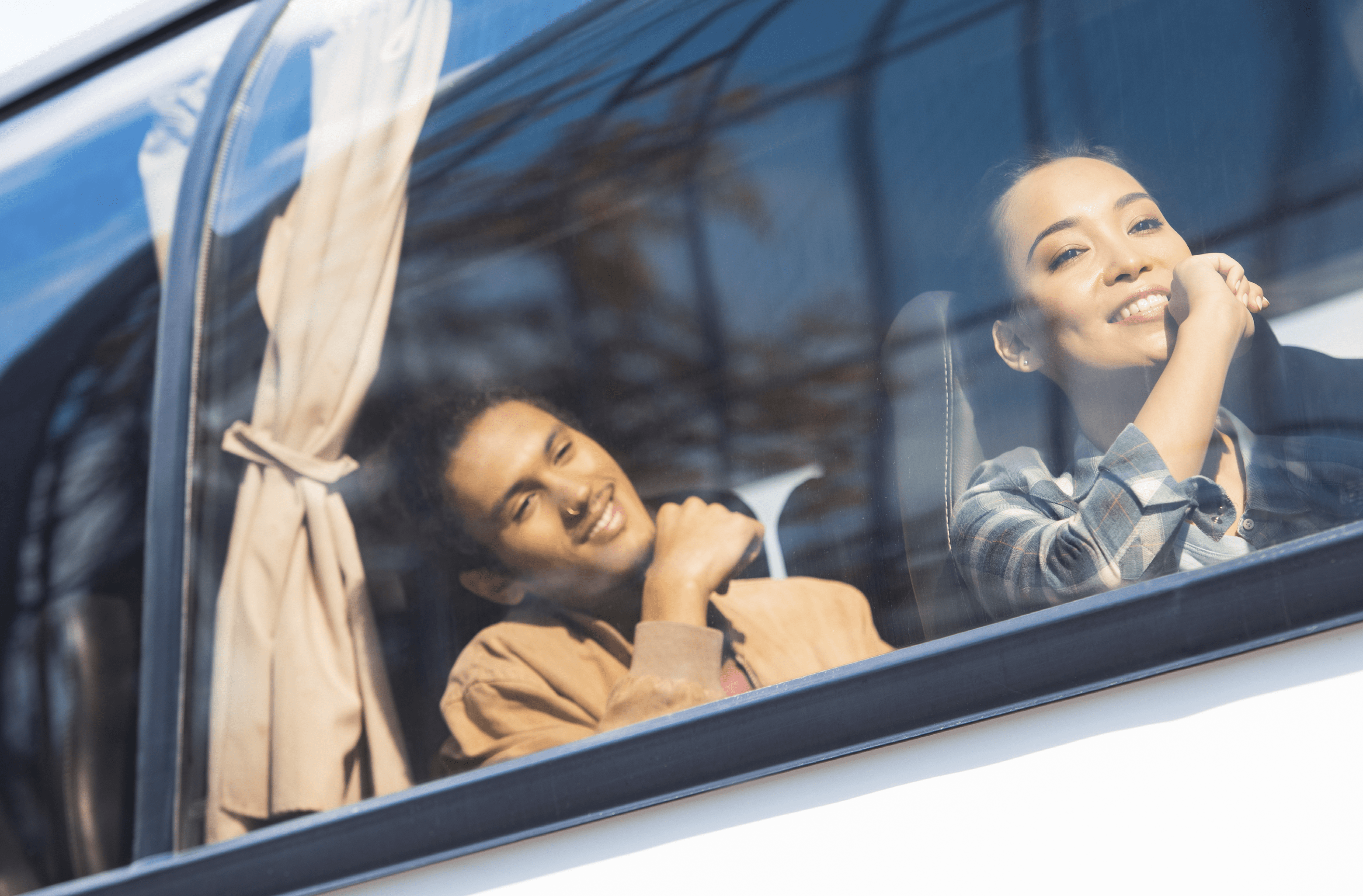 happy asian and mixed race tourists during trip on travel bus