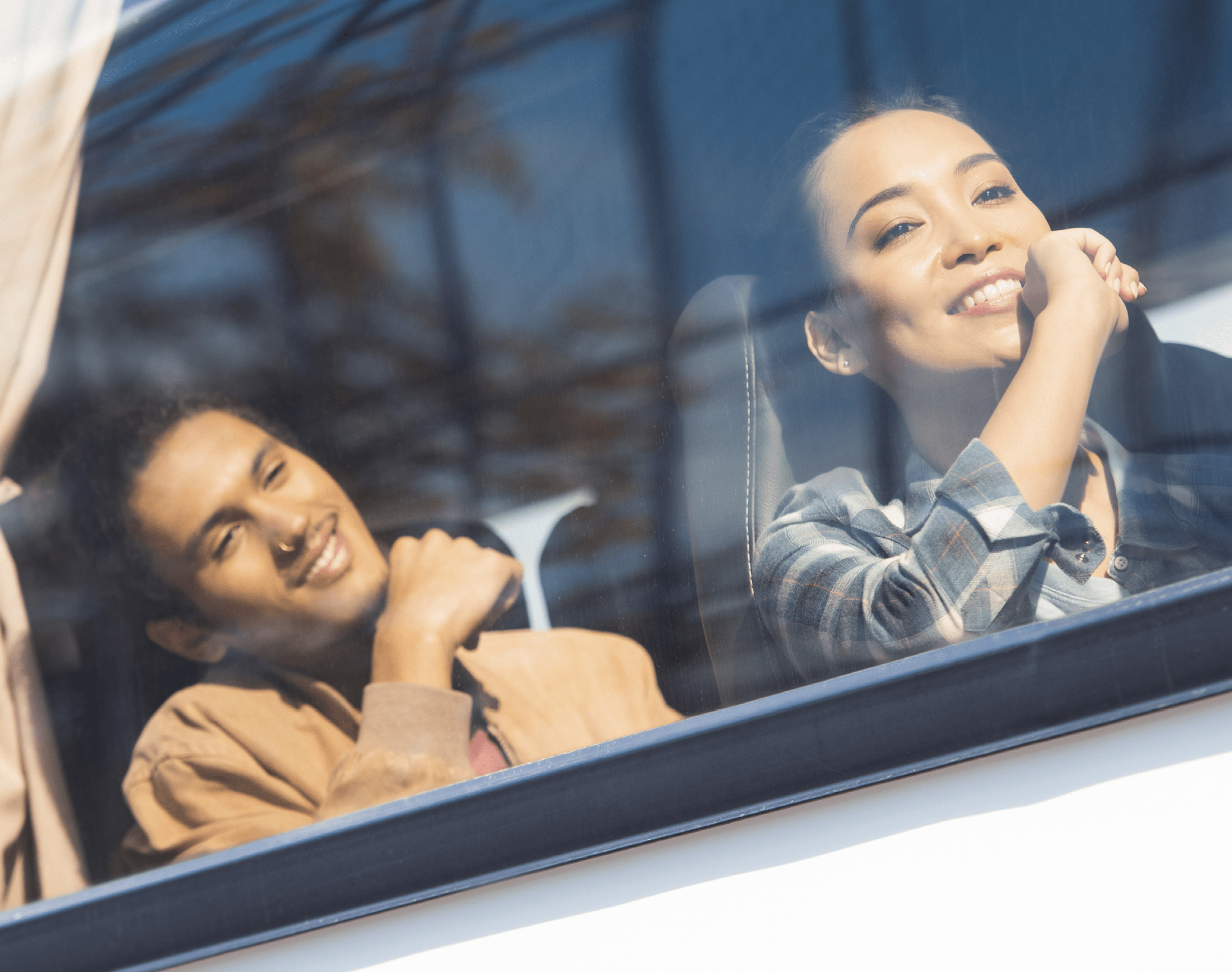 happy asian and mixed race tourists during trip on travel bus